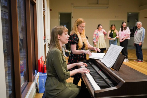 Left to Right: Jess Viner (Musical Director) and Kathryn Lay (Director) lead a rehearsal with the cast of ‘Guys and Dolls’ (Image credit: Georgia Davies)